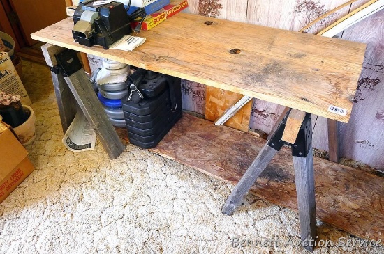 Sawhorse table comes with attached top, measures approx 55"x 24"x 26''.