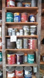 Six shelves of partially filled coffee cans containing nuts, bolts, nails and washers of various