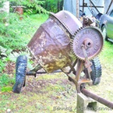 Cool old pull behind cement mixer by Remmel Co. of Kewaskum, Wis. Tip it up and plant flowers in it.