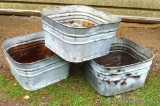 Three square galvanized wash tubs are each 20