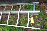 Two sections of aluminum extension ladder may or may not make one 32' ladder. Rails are bent, some
