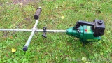 Weed Eater brand trimmer turns over and has compression. Comes with extra weed blades, guard, more.