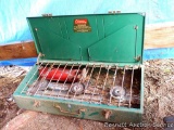 Coleman three burner white gas camp stove had a mouse nest in it, but should clean up well. 29