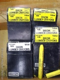 White and yellow Dixon lumber crayons.
