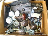 Assortment of door knobs and latches including glass, metal, porcelain and more.