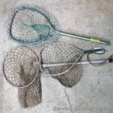 Three fishing nets. One is foam filled. Largest is 14