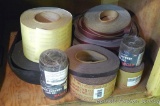 Rolls of abrasive strips includes various grits and sizes.