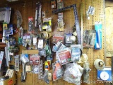 Hardware man's dream wall! Includes door knobs; spray grip; carpenter square; JB Weld and lots more.