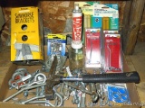 Stone chip hammer; turnbuckles; sawhorse brackets NIP; compact fluorescent bulbs NIP and more.