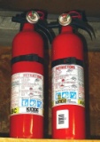 Two Kidde dry chemical fire extinguishers, both show that they're charged and include mounting