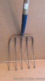 Five tine pitch fork with end of the tines bent into circles 60