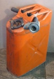 Five gallon military style metal gas can. Has a flexible pouring spout.