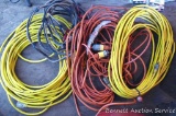 Two heavy duty extension cords with other extension cords.