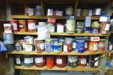 Four shelves of partial coffee cans containing drywall screws, carriage bolts, roofing nails, more.