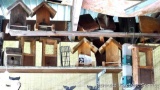 Wooden bird feeders and bird house. Most are 12