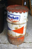 Mobil Oil can about half full of bird seed. A couple of dents noted. Great for seed storage or a