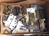 Box of door hinges and other hardware, largest is approx 8