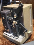 Kodak Sound 8 Model 1 movie projector with audio. Comes with invoice showing repair 25 years ago.