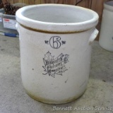 Six gallon Monmouth Pottery stoneware crock is in overall good condition with a couple of chips