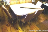 Vintage chromed leg kitchen table set with four matching chairs and two leaves. As pictured the