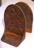 Pair of cast iron book ends could easily be used as door stops are marked 'Racine Steel Casting'.
