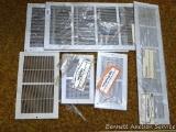 Heat duct vents or wall return grills, largest is 25-1/2