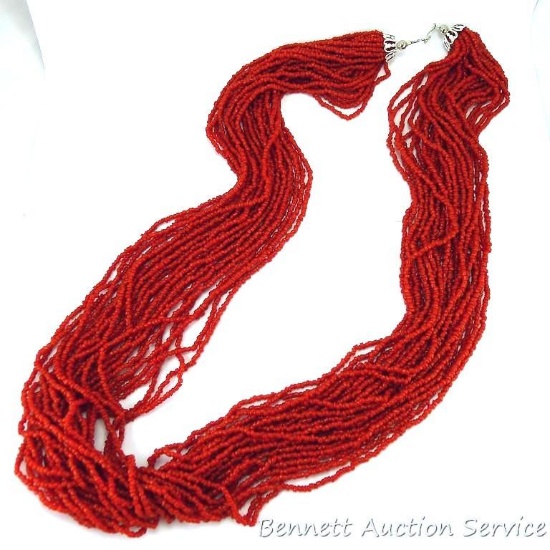Wonderful earthy burnt orange beaded necklace is approx. 15" long and in very good condition.