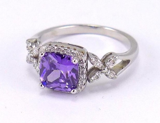 Seller's note states "2CT Sterling silver amethyst and white topaz ring, size 6".