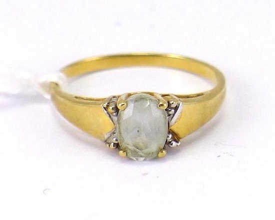 Pretty ladies ring with milky colored stone is size 6, marked '10K' and has a total weight of 1.71