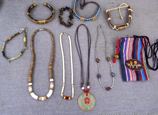 Earth toned necklaces and bracelets; longest necklace is 16" long with a 1-3/4" pendant.