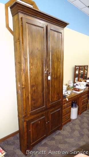 Large wooden corner cabinet offers tons of storage space. Measures 41" x 26" x 94-1/2". Would be