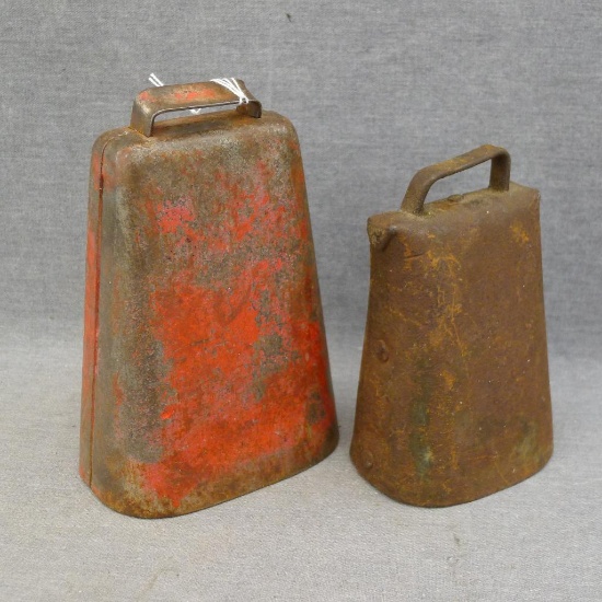Two metal cow bells with original clappers, largest is 6-3/4" x 4-1/2" x 3".