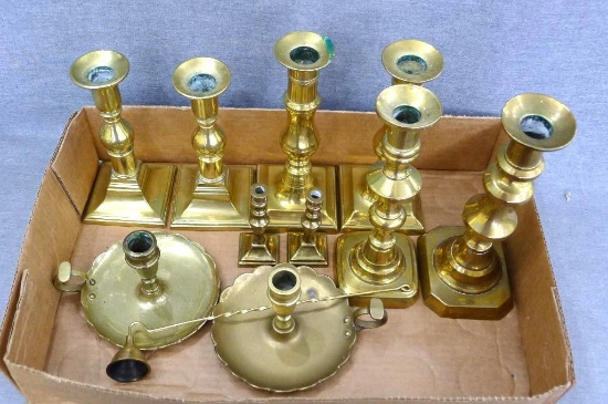 Ten brass candle holders, largest is 8-1/4" tall; brass candle snuffer.