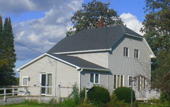 Northern WI country home with huge outbuilding. Beautifully surrounded by fields and forest.