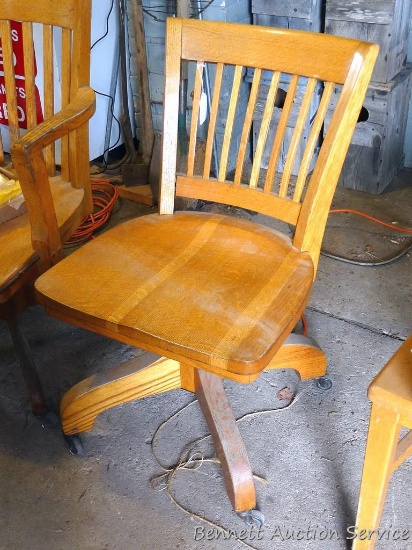 Wooden swivel office chair on rollers 18-1/2" x 18" x 32" tall. Back is a bit loose.