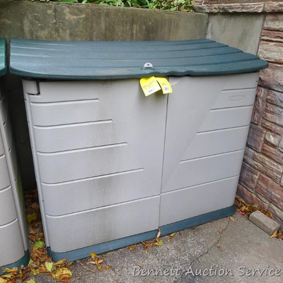 Rubbermaid lawn and garden storage container opens on top and on front. Measures approx. 5' wide x