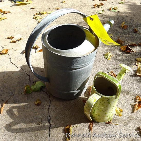 Galvanized watering can stands 15" to top of handle; other decorative watering can.