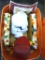 Tote with lid holds table cloths, faux leaves and pumpkin decorations. Tote is about 15