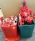 Rubbermaid and other tote hold poinsettas, more. Some still have tags; fiber optic tree is about 2'