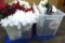 Sterelite and Tamor totes containingribbon, pinecones, bows, and faux poinsettas and other flowers.