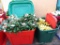 Rubbermaid Roughneck and Tamor totes hold faux holly stems and gold flowers, most have tags. Totes