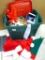 Rubbermaid Roughneck tote holds Santa and elf hats, candles, planter, bells, Santa apron, more. Tote