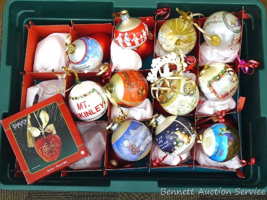 Rubbermaid tote with lid holds several ornaments up to aout 3-1/4" wide. Tote is about 9" tall.