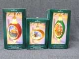 Three Hallmark Illuminations tree ornaments with boxes. Look to have original packaging.