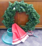 Large faux Christmas wreath, two tree stands, Christmas tree skirt. Larger tree stand is approx 2'