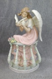Member's Mark hand painted porcelain angel looks to be in good condition. Stands about 12