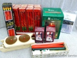 Lots of NIP taper candles, plus some candle holders and a vinyl table protector. Red tapers in boxes