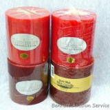 Two cranberry and two cinnamon scented candles. All have three wicks and measure approx 5-1/2