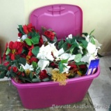 Sterilite tote contains faux poinsetta and other arrangements, some have tags. Tote is about 2' over