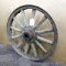 Antique wheel has wooden spokes and is about 21